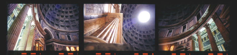 Color photo of the interior of the landmark Pantheon in Rome including columns, ceiling, and oculus